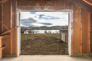 Horse barn with a water and mountain view