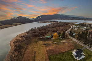 Aerial view at dusk of a water and mountain view
