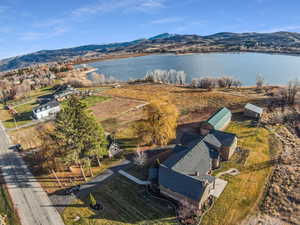 Aerial view of property's location with a water and mountain view