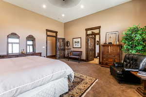 Carpeted bedroom featuring recessed lighting and ceiling fan