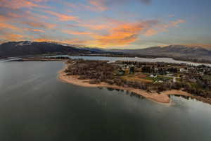 Aerial overview of property's location featuring a water and mountain view