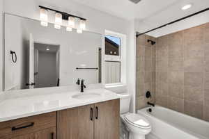 Bathroom with vanity and shower / tub combination