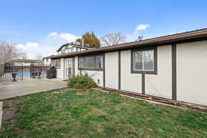 Back of property featuring stucco siding and a patio area