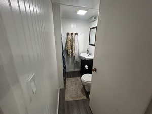 Bathroom featuring vanity and dark wood finished floors