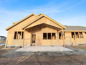 Rear view of property featuring a patio area