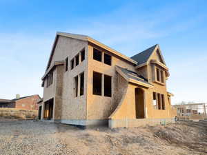 View of front facade featuring stucco siding