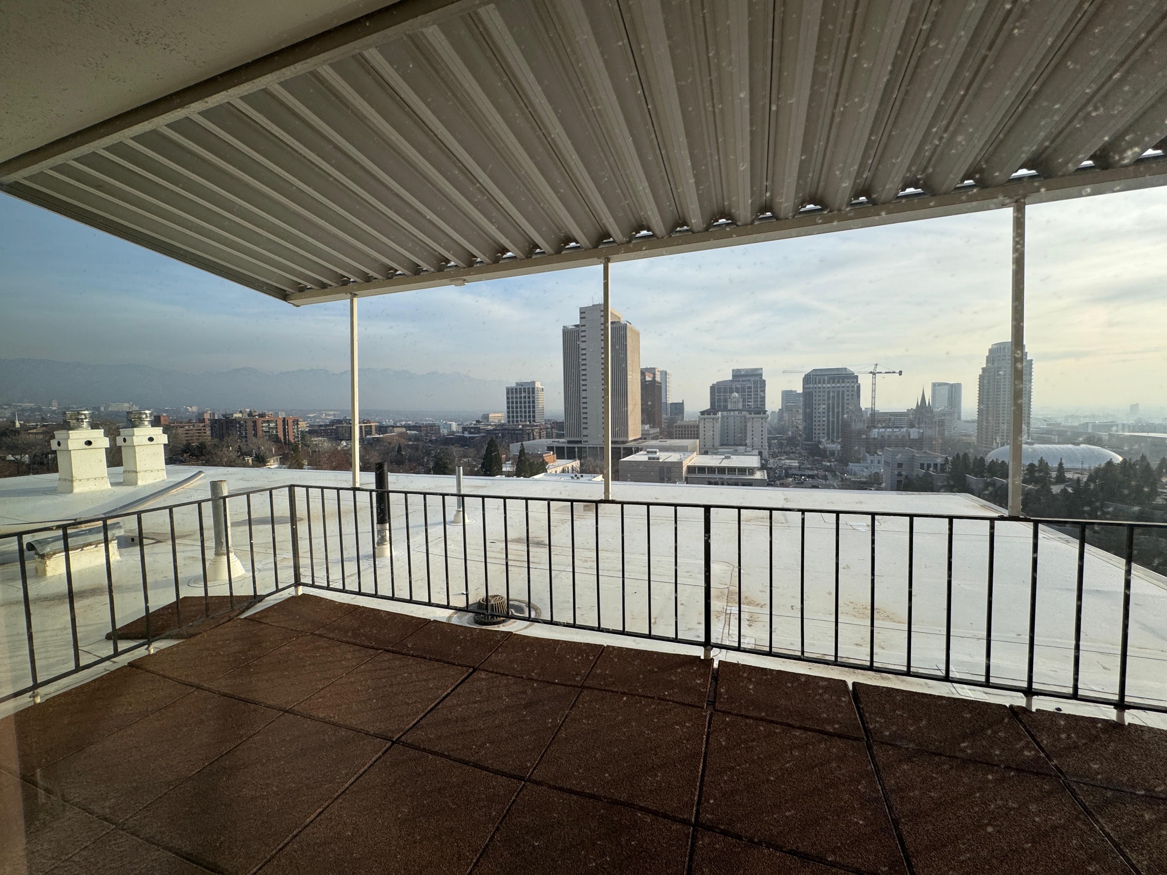 Balcony featuring a view of city