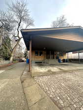 View of car parking with a carport and driveway