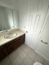 Bathroom with vanity and light tile patterned floors