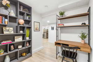 Office featuring light wood-style floors and recessed lighting