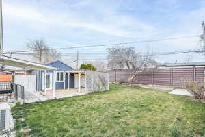 Fenced backyard with a patio area