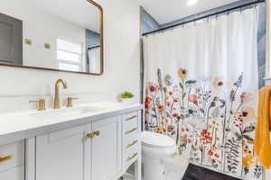 Bathroom featuring vanity and a shower with curtain