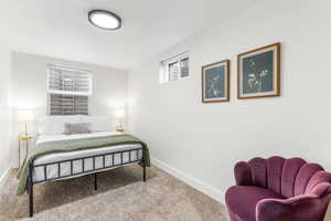 Bedroom with carpet floors and a textured ceiling