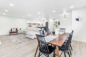 Dining space with recessed lighting and light wood-style flooring