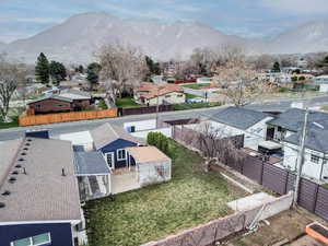 Aerial view of residential area featuring a mountainous background