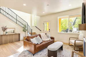 Living room featuring wood finished floors and recessed lighting