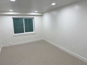 Unfurnished room featuring carpet flooring and recessed lighting