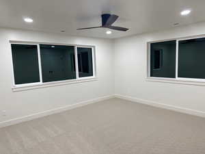 Spare room with light colored carpet, recessed lighting, and ceiling fan