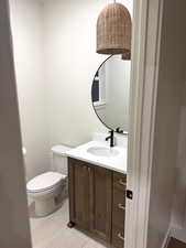 Bathroom featuring vanity and toilet