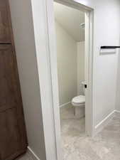 Bathroom with baseboards and a textured ceiling