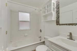 Full bath with vanity and shower / bath combination