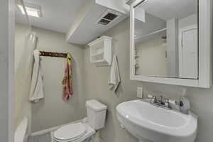 Bathroom featuring a sink and toilet