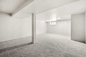 Below grade area featuring carpet floors and baseboards