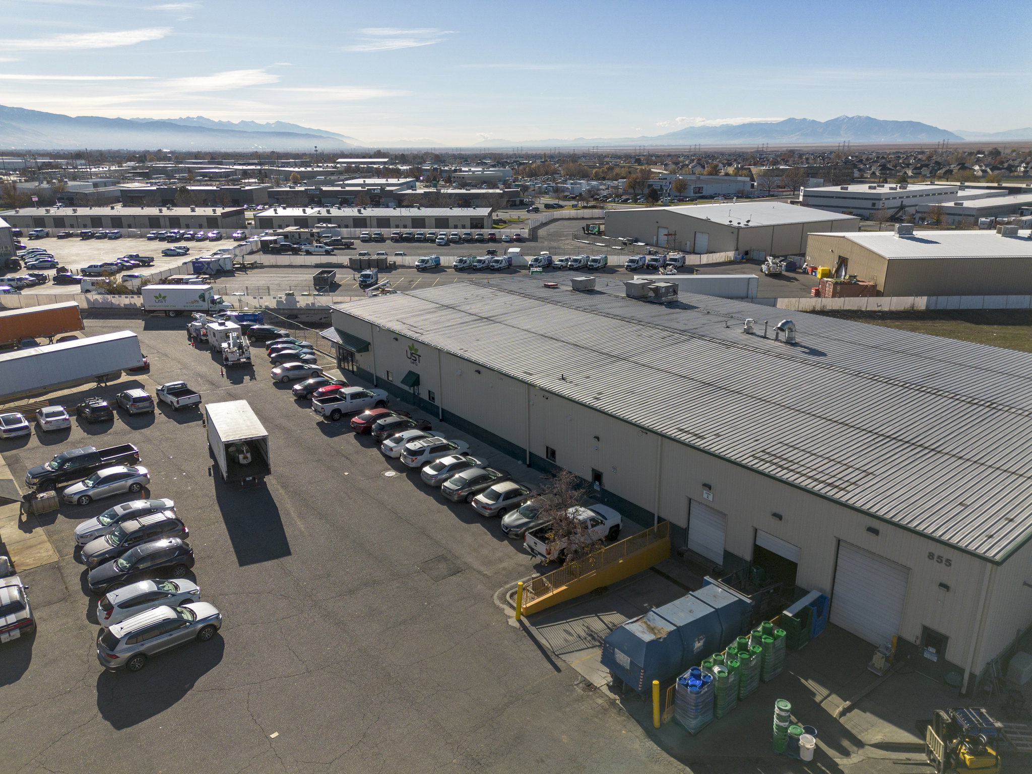 Drone / aerial view of an industrial area and mountains