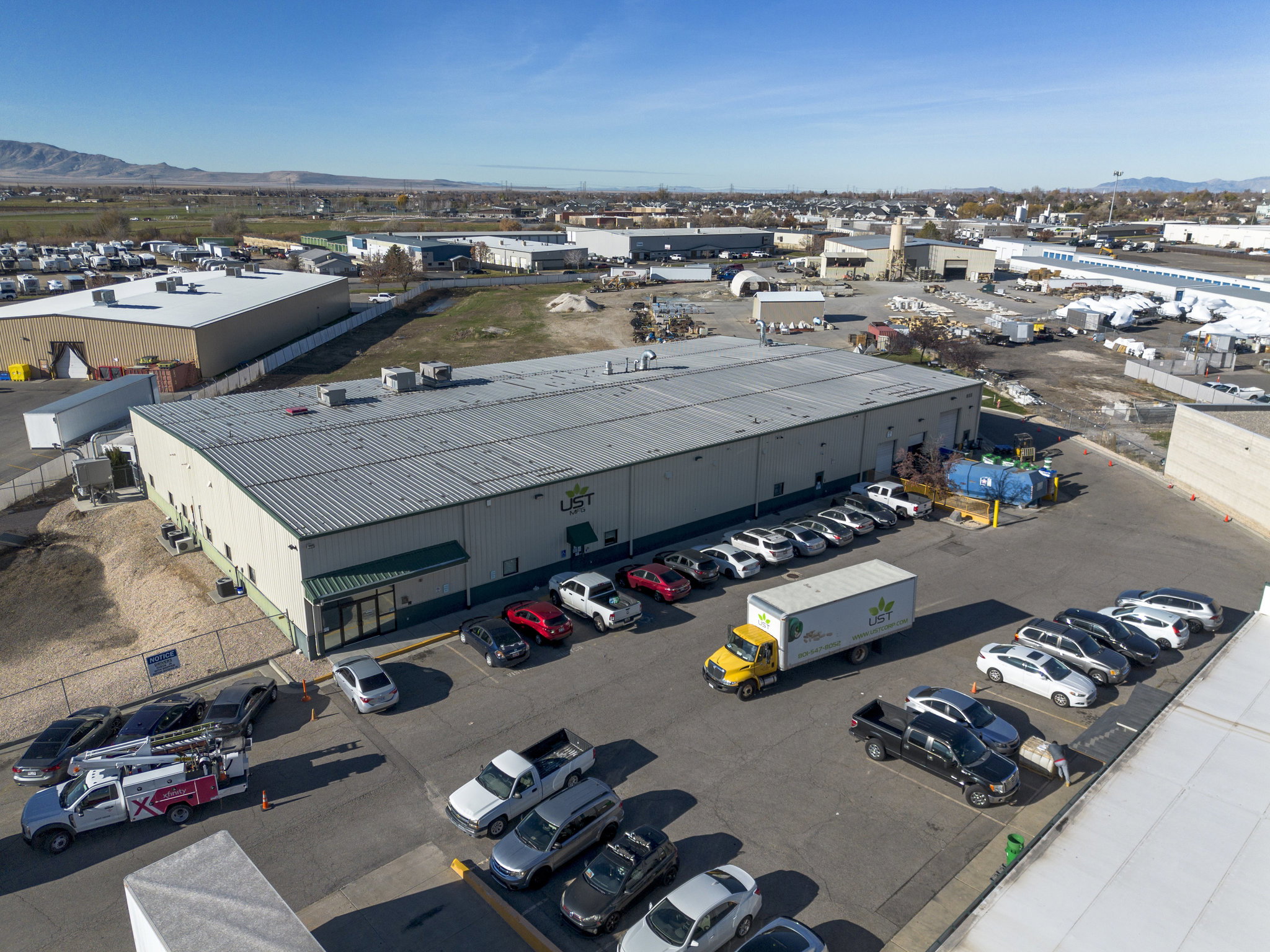 Drone / aerial view of industrial structures and mountains
