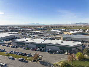 Bird's eye view of an industrial area and a mountain backdrop