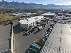 Bird's eye view of industrial structures and a mountain backdrop