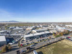 Aerial view of a mountain backdrop and industrial structures