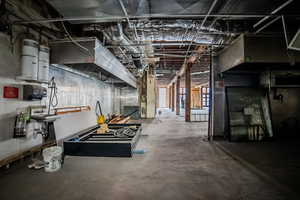 Unfinished basement featuring heating unit