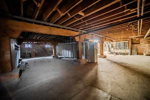 Basement featuring heating unit