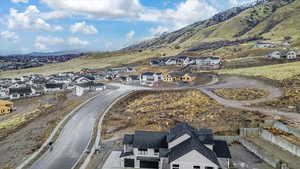 Aerial view of residential area featuring a mountainous background