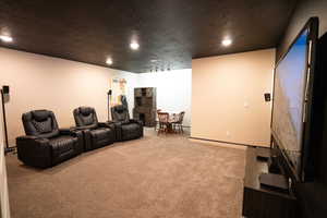 Cinema room featuring carpet flooring and recessed lighting