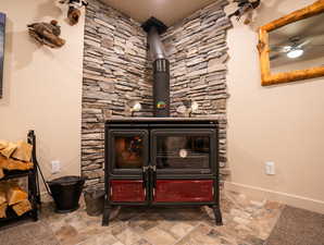 Detailed view of a wood stove and a ceiling fan
