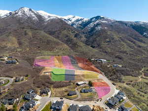 Drone / aerial view of a mountainous background lot highlighted in Yellow