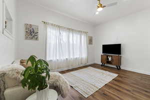 Bedroom with ceiling fan and wood finished floors