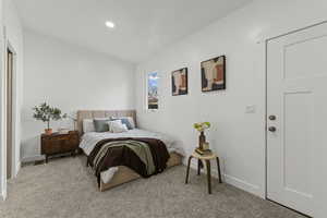 Carpeted bedroom featuring baseboards and recessed lighting