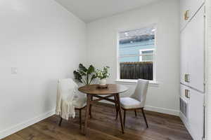 Dining room with dark wood finished floors