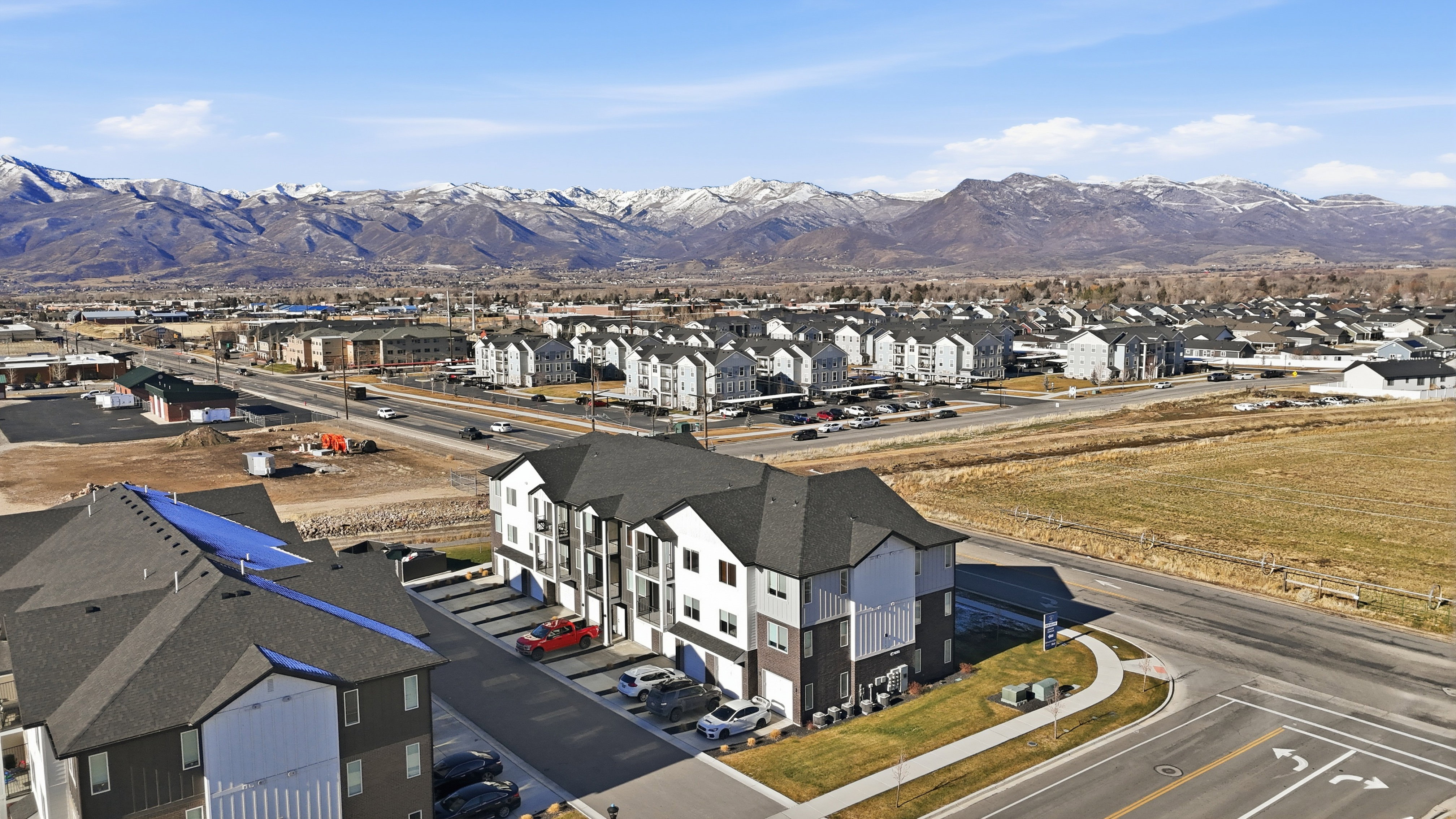 3RD FLOOR UNIT. Aerial view of residential area with a mountain backdrop
