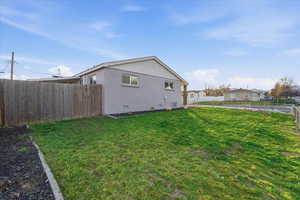 View of side of property featuring crawl space and brick siding