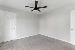 Unfurnished room with carpet floors and ceiling fan