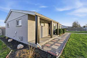 View of home's exterior with brick siding and crawl space