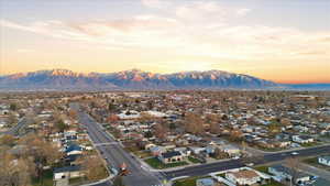 Aerial view at dusk of a residential view and a mountain view