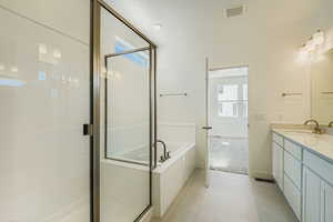 Full bathroom with a garden tub, a shower stall, vanity, light carpet, and light tile patterned floors