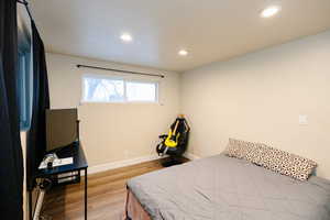 Bedroom featuring light wood finished floors and recessed lighting