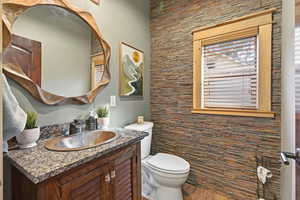 Bathroom with vanity and toilet