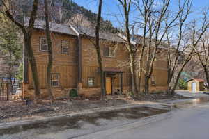 Chalet / cabin featuring an outbuilding and board and batten siding